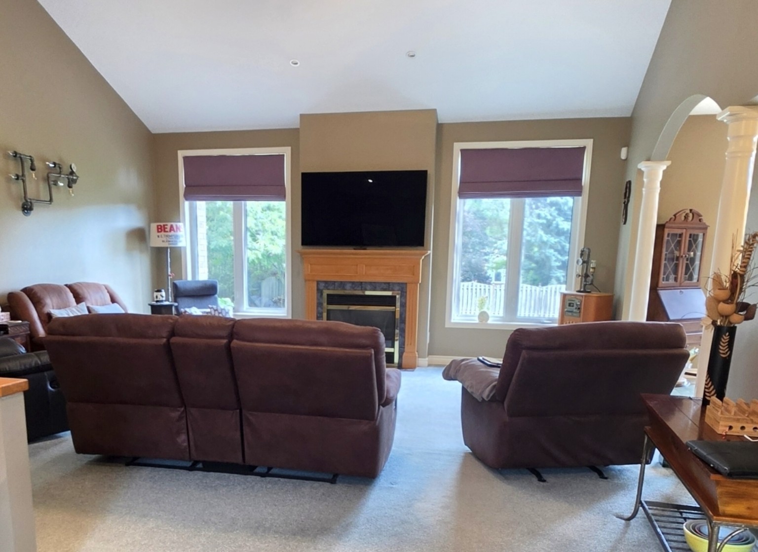 Before: living room before staging, with dark recliners