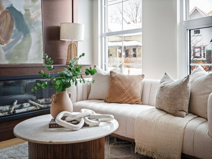 Close-up of a cream sofa and coffee table styling